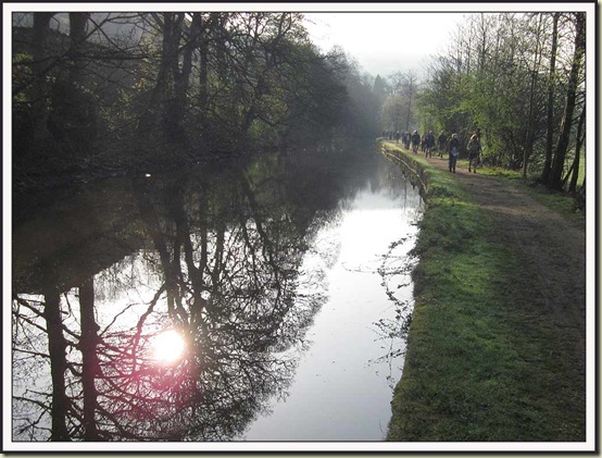 The Rochdale Canal beyond Luddenden Foot, with walkers on the Calderdale Hike