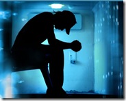 silhoutte-of-desperate-teenager-praying-on-abstract-background