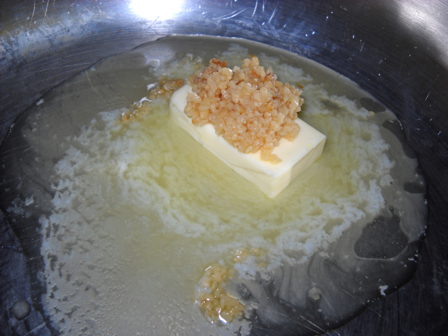 garlic and butter in pan on stove top melting 