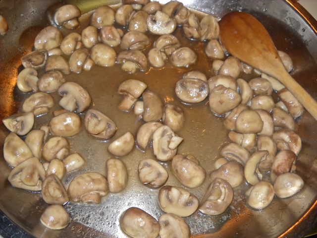 cooked mushrooms in pan, they have released their water and are done