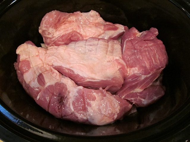 pork placed in slow cooker