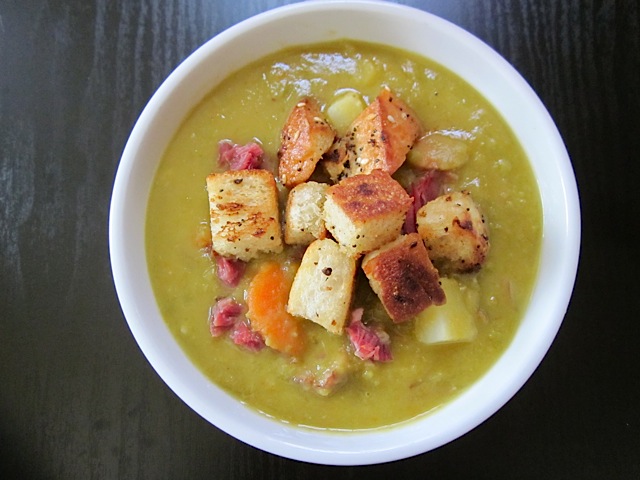 finished bowl of homemade chunky split pea soup with croutons