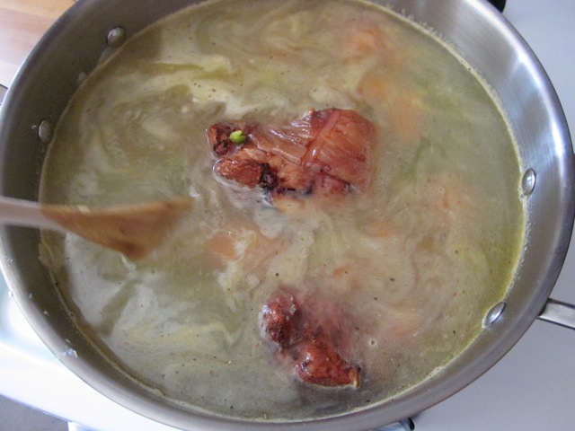 Chicken broth added to the soup pot
