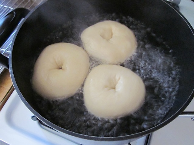 bagels boiling in pot 