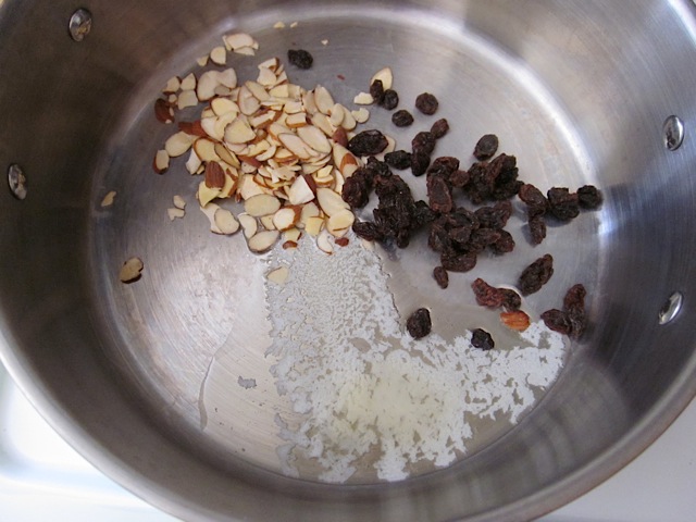 butter, raisins and almonds in pot 
