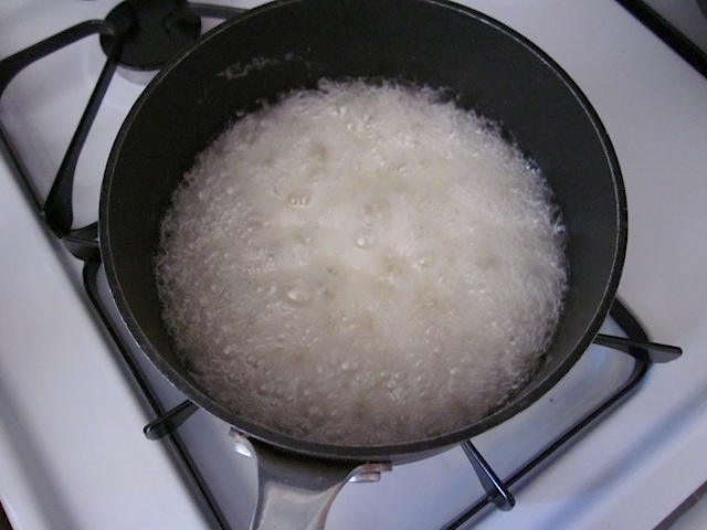 top view of boiling sugar mix in pot on stove
