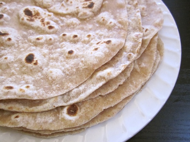 Stack of Flour Tortillas whole wheat on white plate 