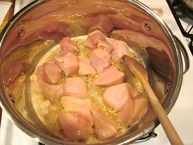 chicken added to butter to brown in pot 