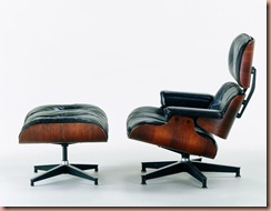This is Charles and Ray Eames, Lounge Chair and Ottoman, 1956, Molded rosewood plywood, black leather upholstery, aluminum 33 x 33 x 33” (chair) 16 x 26 x 21” (ottoman) Grand Rapids Art Museum, Gift of La Vern and Betty DePree Van Kley. Photographer: Nick Merrick. Source: Museum of Arts & Design via Bloomberg News 