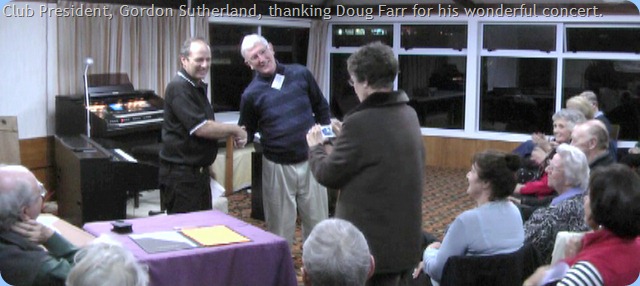 Club President, Gordon Sutherland, thanking Doug Farr for a great concert. Whilst Club Secretary, tries to take a photo with an unfamiliar camera. This photo is a video frame grab and so not as sharply in focus as desirable.