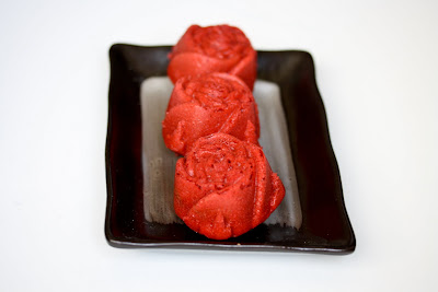 photo of three Red Velvet Roses on a plate