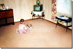 ist2_157028-little-girl-watching-first-television-retro-vintage-style
