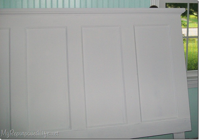old door re-imagined into a headboard headboard made from a door