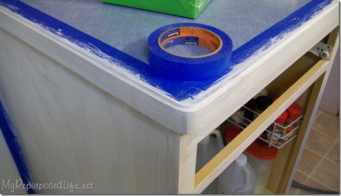 tape counter (2) oak cabinets (taping)