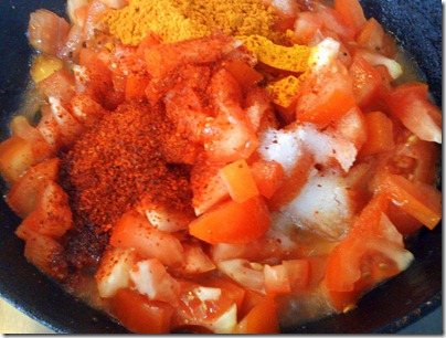 Add redhilli,turmeric,sambar powders and salt Add redhilli,turmeric,sambar powders and salt