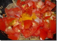 Add tomatoes and turmeric