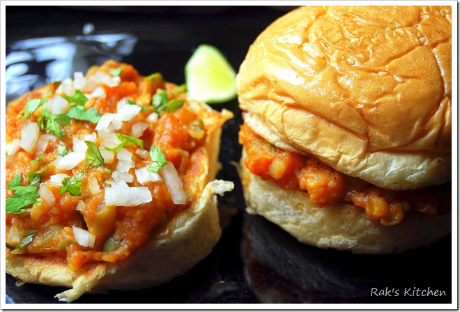 Buns spread with bhaji and topped with chopped onion and coriander leaves Buns spread with bhaji and topped with chopped onion and coriander leaves