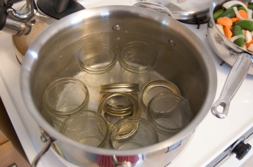 Picture of boiling water and canning jars.