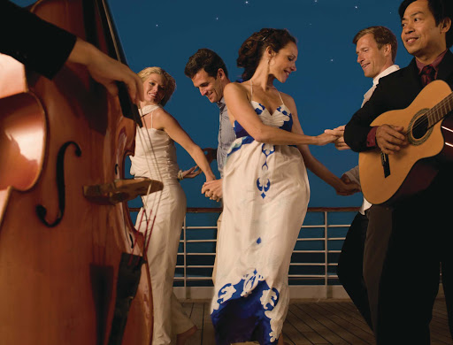 Sway to the music and feel the night breeze while dancing on the deck of Seabourn Legend.