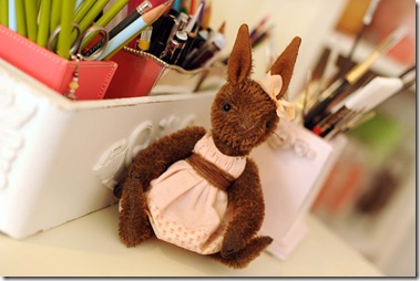 Bunny with pencils and bookshelf