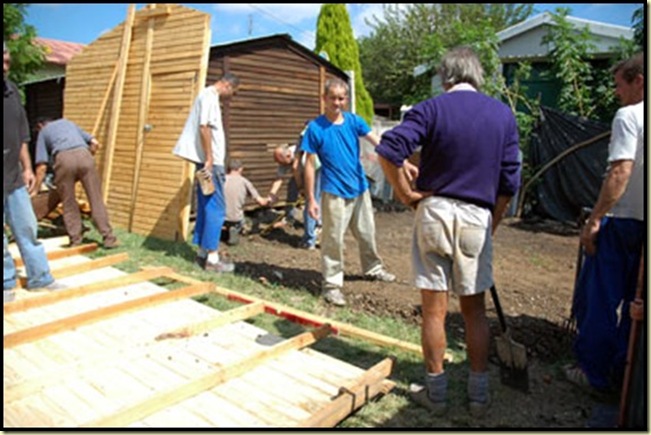 Afrikaner charity workers who built huts for their countrymen were arrested and charged by the ANC-council June 2010