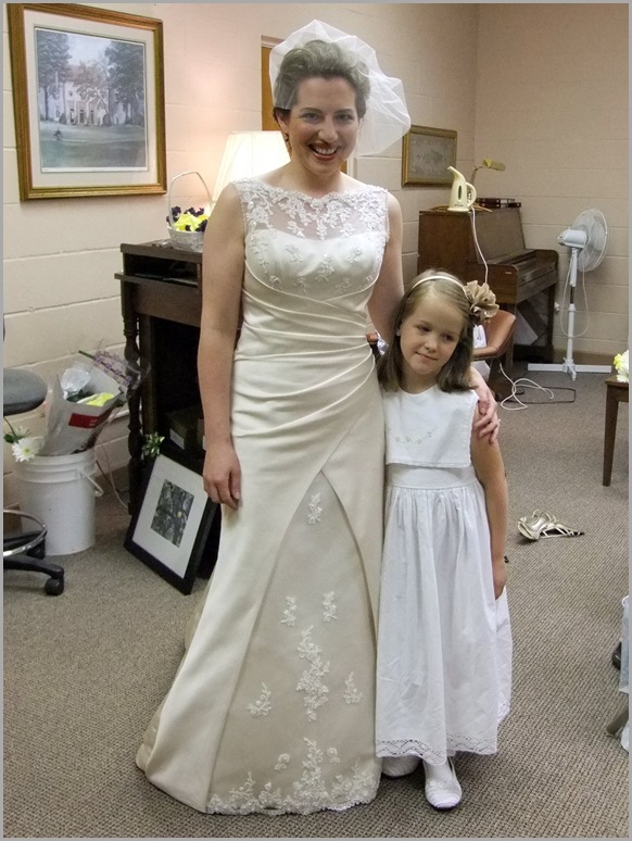 Mary in Her Wedding Dress with Flower Girl Catia