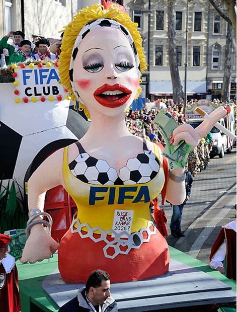 A carnival float shows the FIFA as a prostitute during the traditional Rosemonday carnival parade in Cologne, Germany, Monday, March 7, 2011.  The Rosemonday parade in Cologne, visited by one million spectators, is one of the highlights of the street carnival season. (AP Photo/Martin Meissner)