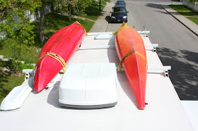  kayaks on the roof of an RV. They could be lethal if they ever fell