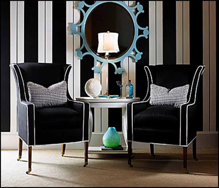 A modern take on a classic wing chair features upholstery in black woven acrylic boldly trimmed in white welting. The slender exposed wood legs have casters. Checkered houndstooth pillows extend the menswear theme and add punch. Here, black and white is dominant against a lively wall of stripes, where a sky-blue mirror stands out like a jewel. This chair from Century Furniture sells for $3,600.
Photo from Century Furniture
PRIMARY COLOR HG JAN08