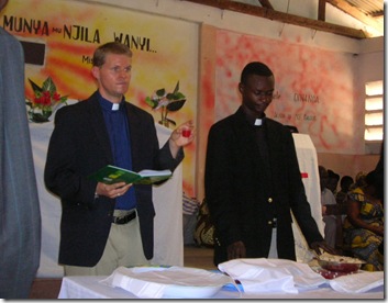 Bob and pastor Kabasele serve communion