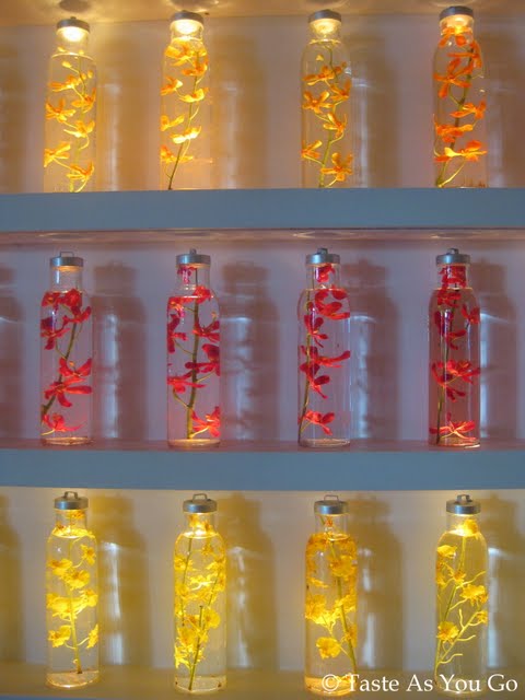 Wall of Decorative Bottles at Kittichai in New York, NY - Photo by Taste As You Go