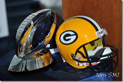 Green Bay Packers helmet with George S. Halas NFC Championship Trophy.