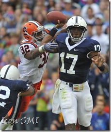 12 September 2009:  Penn State QB Daryll Clark rolls out and throws as Syracuse's Doug Hogue (32) hits him as he throws.  Clark threw for 240 yards and 3 TDs.  The Penn State Nittany Lions defeated the Syracuse Orangemen 28-7 at Beaver Stadium in State College, PA.
