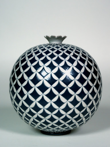 Sherical vase with geometric decoration