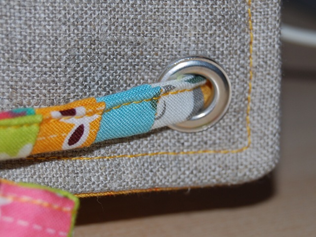 Sewing machine cover eyelet