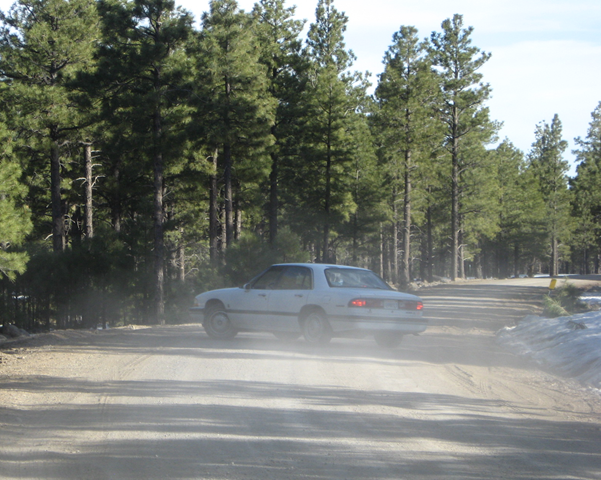 [car turning in dust cropped[5].png]