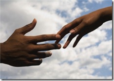 hands-of-couple-reaching-for-each-other-resize