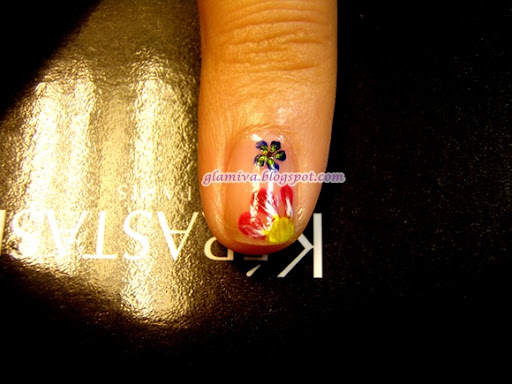red yellow and blue flowers nail art design with butterfly wings