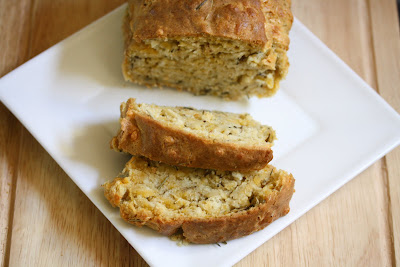 photo of a slice loaf of Rosemary cheese beer bread on a plate