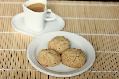 photo of a plate of cookies and a mug of coffee