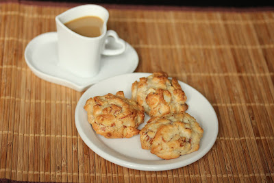 overhead photo of a plate of cookies with a mug of coffee