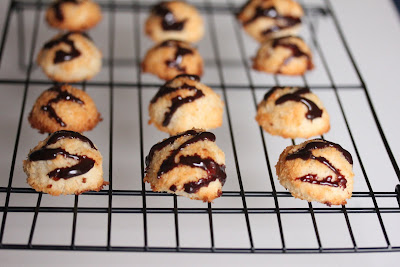 photo of macaroons with chocolate ganache on a baking rack