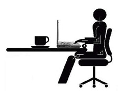 man-seated-at-computer-in-office