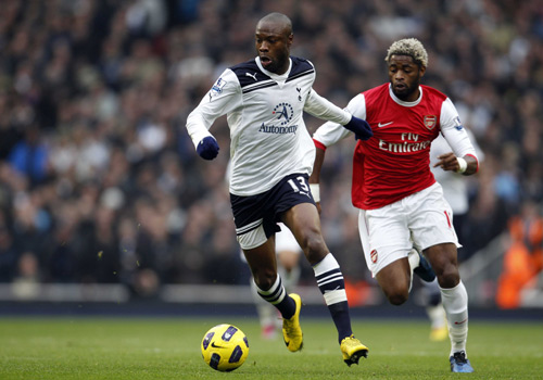 Tottenham Hotspur's William Gallas competes with his old Arsenal's friend Alexandre Song