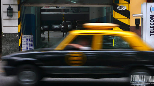 Speedy Radio Taxi Rushing Through the Streets of Buenos Aires, Argentina