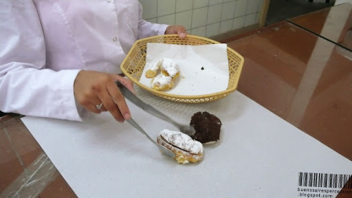 Working Hands are about to Wrap Facturas / Pastries in a Bakery in Buenos Aires, Argentina