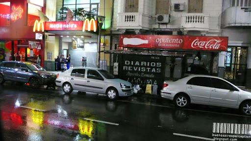 Colorful Reflection of the Exterior Lighting of a McDonald's Restaurant after the Rain in Buenos Aires, Argentina
