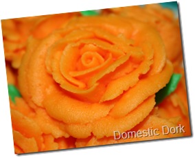 orange Wilton cake decorating class rose