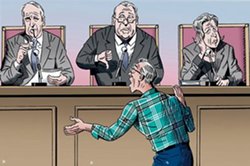 Man argues in front of a panel
