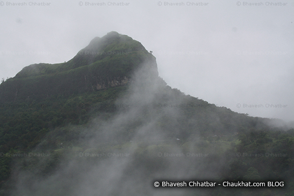 Peak of Tamhini ghat rising above the clouds of monsoon
